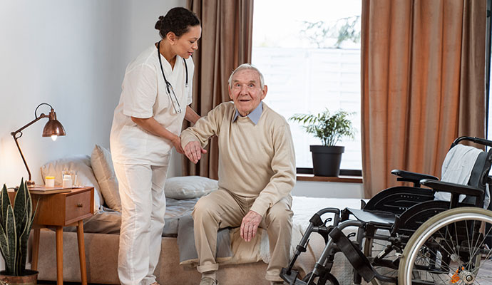 A women doctor helping a old male patient Doctor helping a old male patient