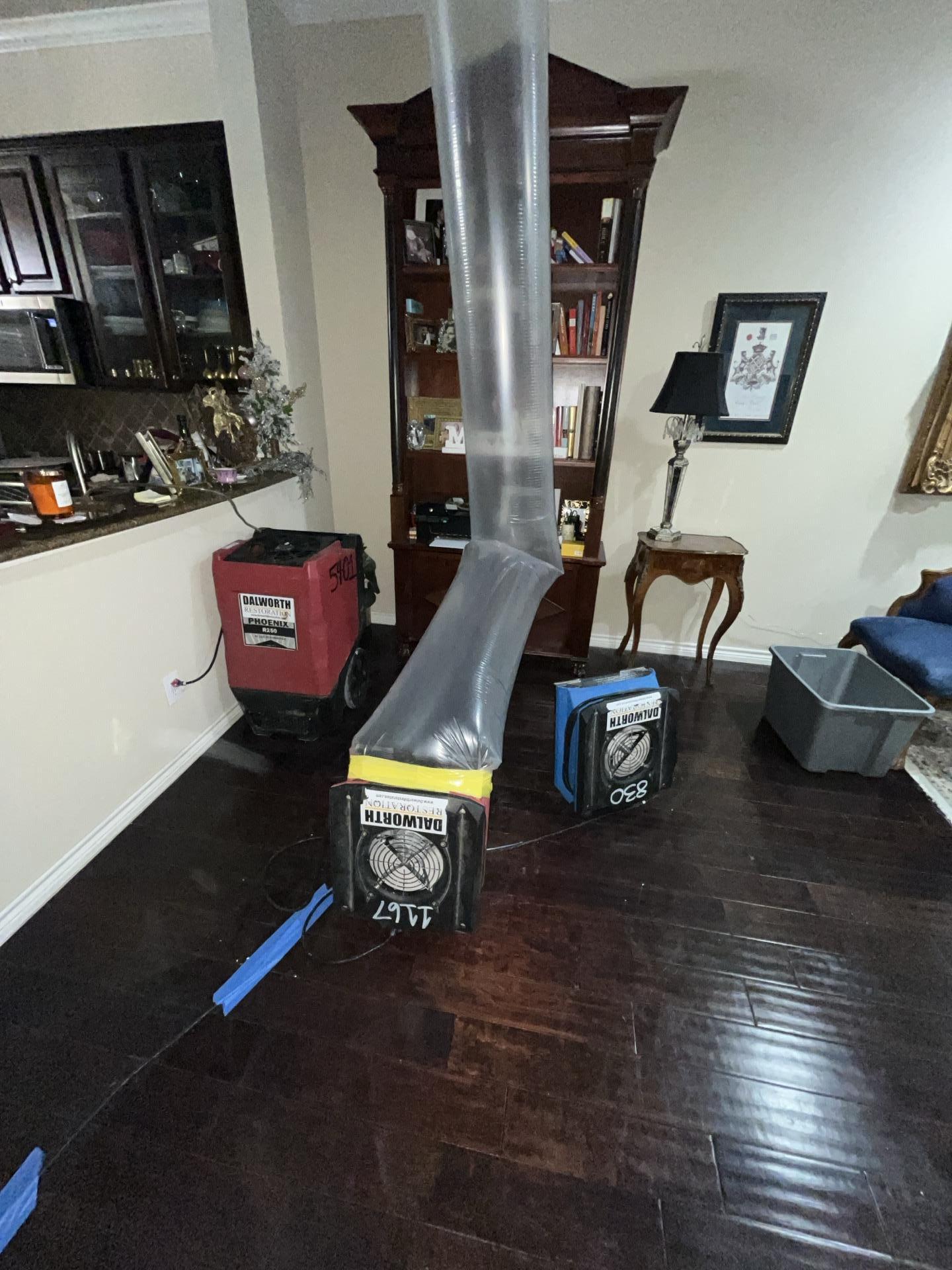Close-up of professional dehumidification and structural drying equipment used for targeted moisture control and emergency water cleanup after interior property damage.