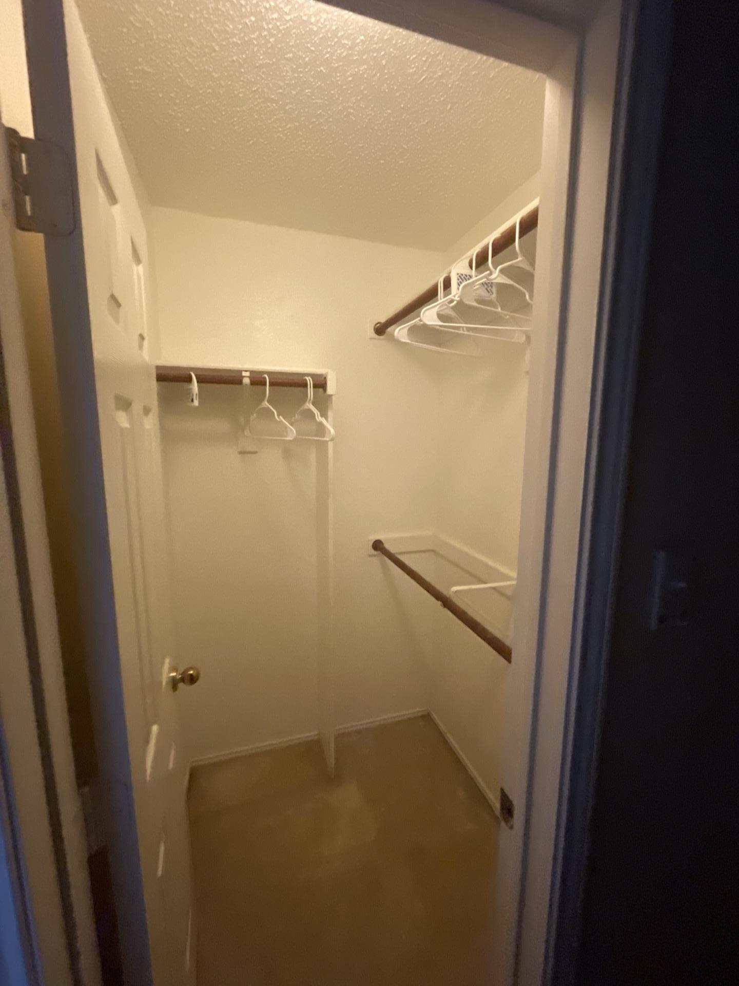 Empty closet within a bedroom, inspected and dried as part of water damage restoration.