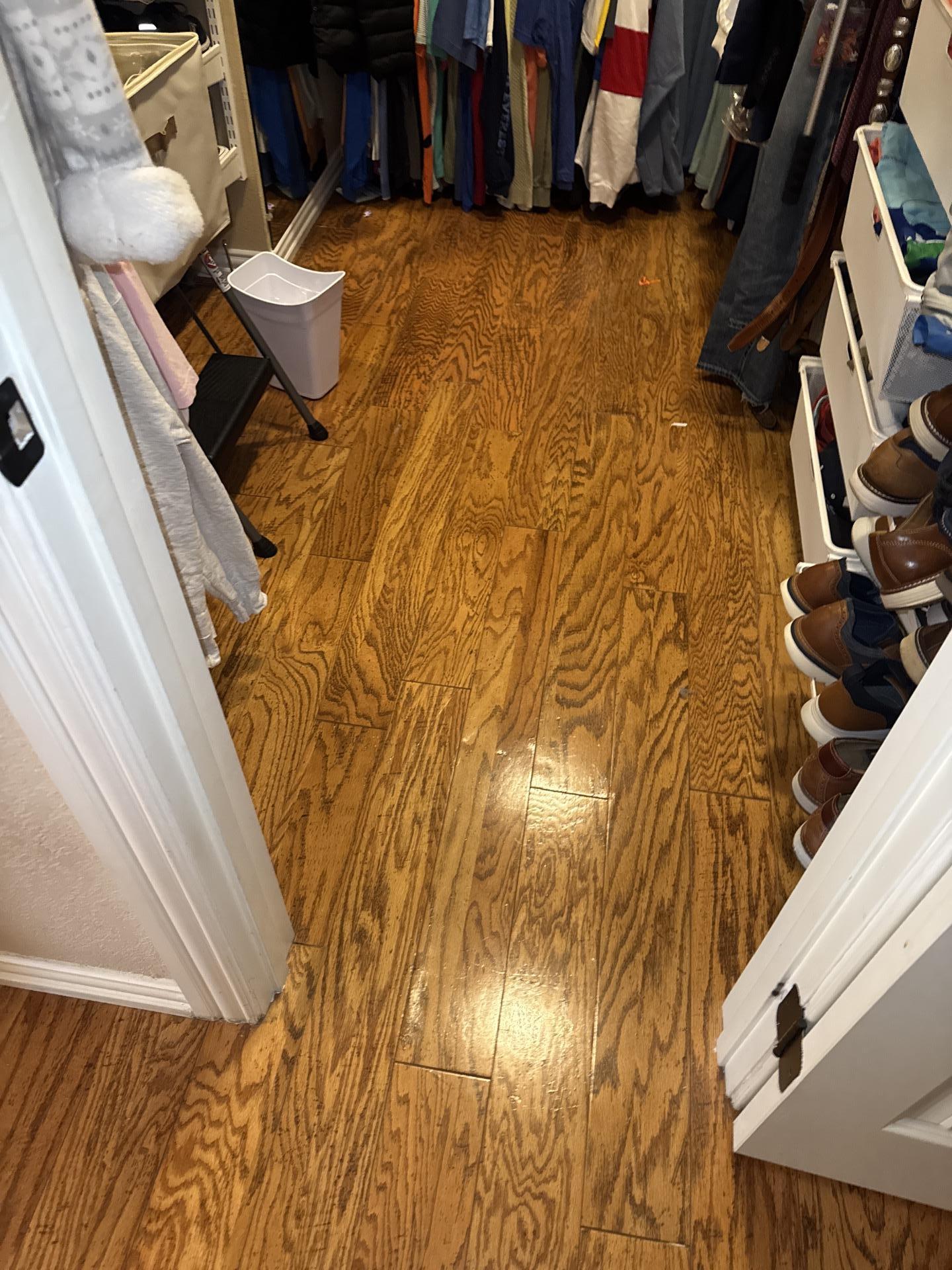 Interior view of a closet with fully restored wooden flooring post-water damage